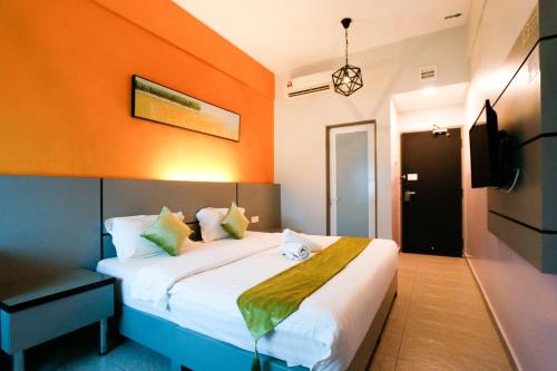 Postel nebo postele na pokoji v ubytování Travelland Hotel