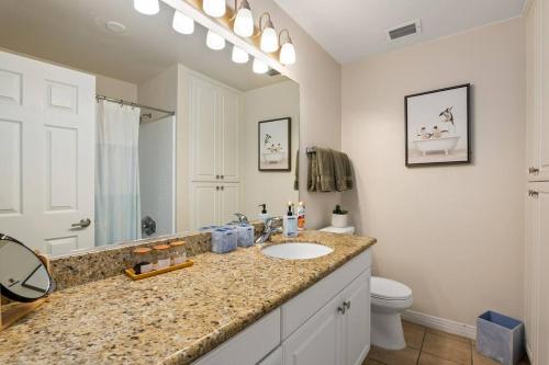 a bathroom with a sink and a toilet at The Bleu Pearl 3Bed 2bath Venice Beach/MDR/SM in Los Angeles