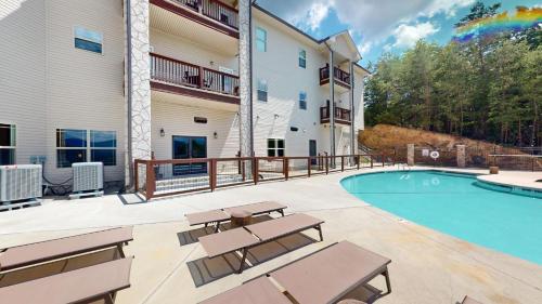 a patio with a swimming pool and patio furniture at Viewpoint Condominiums in Pigeon Forge
