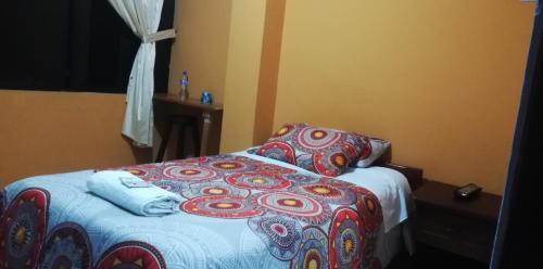 Ein Bett oder Betten in einem Zimmer der Unterkunft Centro Macas