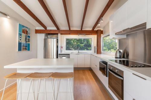a kitchen with a white counter and a window at The Pole House in Elizabeth Beach