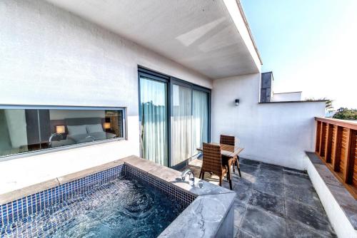a swimming pool in the middle of a house at Jeju Breeze in Seogwipo