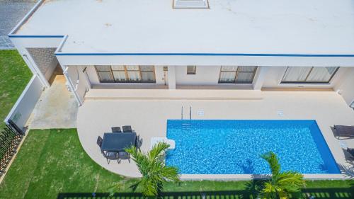 an overhead view of a swimming pool in a house at Summer Palace Miyako in Nishibaru
