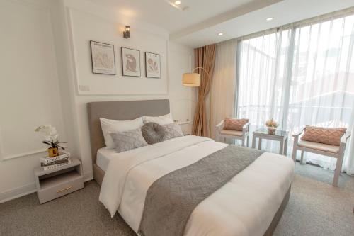 Postel nebo postele na pokoji v ubytování Keypad Hotel - 87 Nguyễn Khang