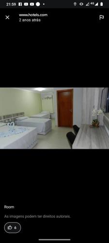 a picture of a room with two beds in it at Araras CTC Apart Service in Caldas Novas