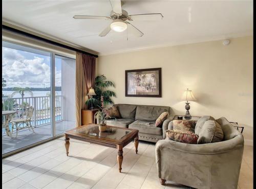 a living room with a couch and a table at Disney just 1 and a quarter mile away, Blue Heron 1 room 2 bath,amenities,6 guests, walk to restaurants in Orlando