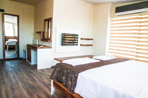 Katil atau katil-katil dalam bilik di Ale Park Hotel Apartments