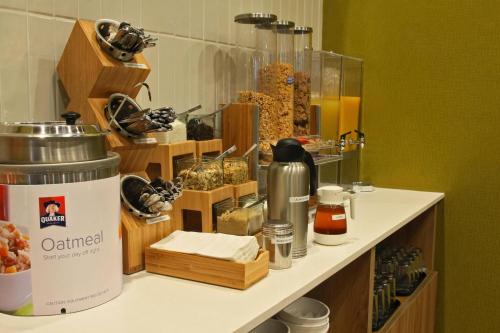 a counter with a shelf with food on it at Fairfield Inn & Suites by Marriott Mexicali in Mexicali