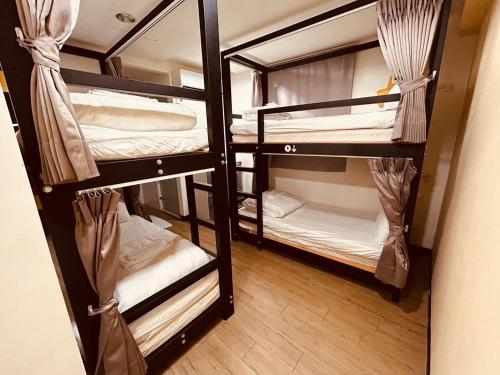 Katil atau katil-katil dalam bilik di 淡水民宿-台北Yes Hotel