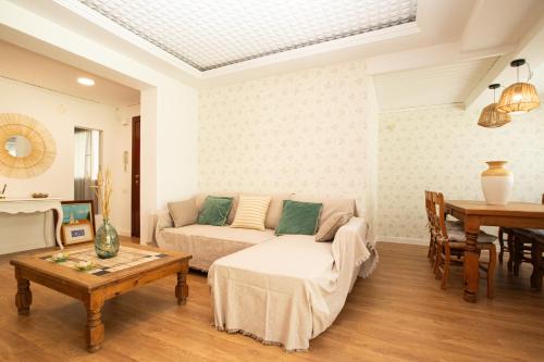 a living room with a couch and a table at Apartamento La Luz by Clabao in Denia