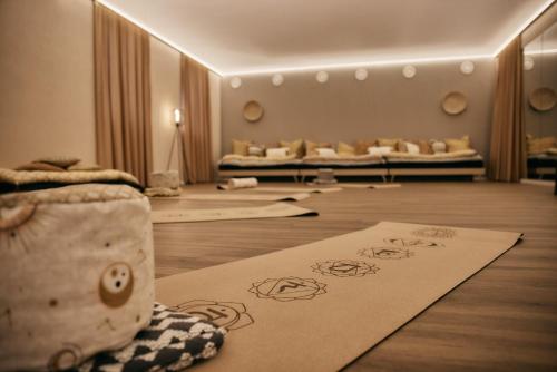 a living room with a couch and some rugs on the floor at Holzapfel in Bad Füssing