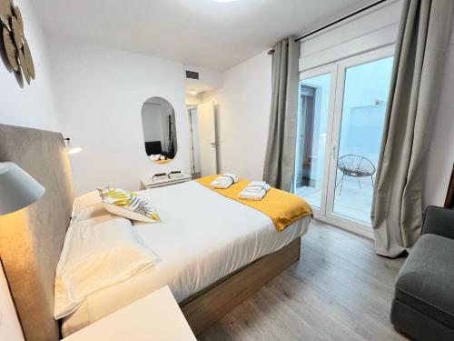 Postel nebo postele na pokoji v ubytování PUSHE Playa Granada Beach & Golf 15