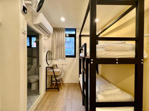Katil atau katil-katil dalam bilik di 淡水民宿-台北Yes Hotel