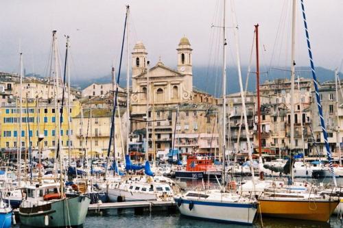 a group of boats docked in a harbor with buildings at Bastia Room in Bastia