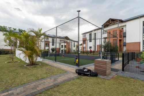 a basketball hoop with a helmet laying on the grass at BALLITO HILLS , 2 bedroom apartment in Ballito
