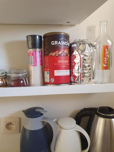 a shelf with a book and other items in a refrigerator at Appartement in Oujda
