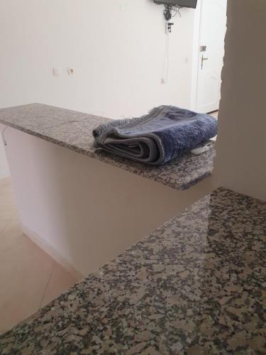 a towel is sitting on a counter in a room at Appartement in Oujda