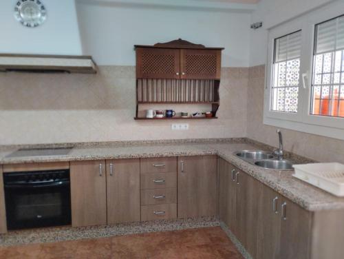 a kitchen with a sink and a counter top at Villa Remedios in Cuevas del Becerro
