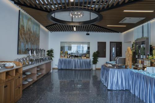 a store with blue tables in a room at Sensory Park Urban Hotel in Phnom Penh