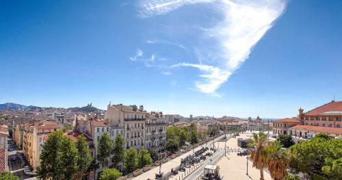 a view of a street in a city with buildings at ibis Marseille Centre Gare Saint Charles in Marseille