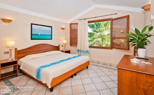Ένα ή περισσότερα κρεβάτια σε δωμάτιο στο Residence Baia delle Palme Unit 1-Studio