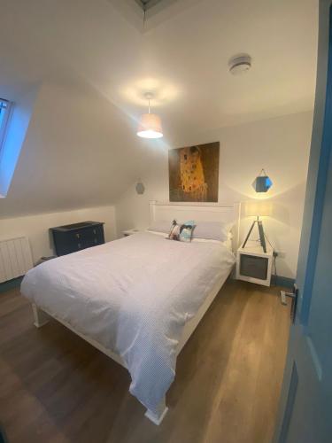 a bedroom with a large white bed in a room at Island View Apartment in Droíchead an Chláir