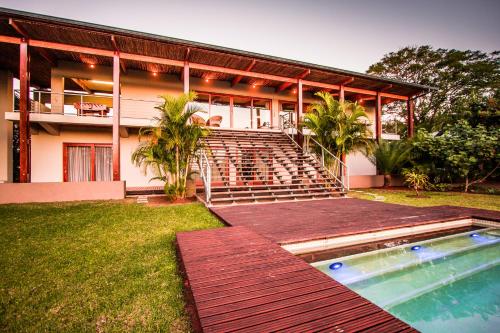 una casa con piscina frente a ella en Ongoye View Residence - Mtunzini, en Mtunzini