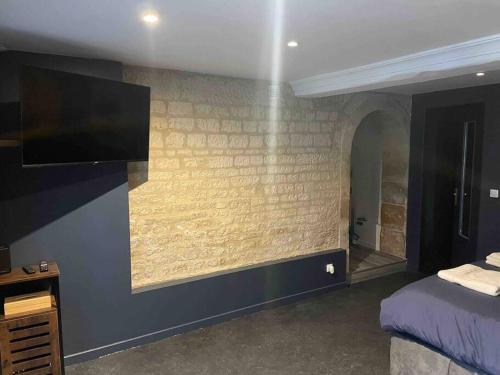 Ένα ή περισσότερα κρεβάτια σε δωμάτιο στο Loveroom En Aparté Caen