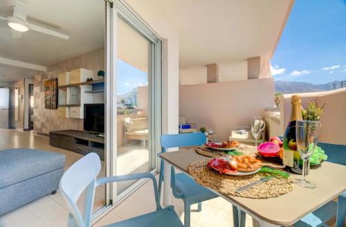 a kitchen and living room with a table and chairs at Belle Vue in Playa Paraiso