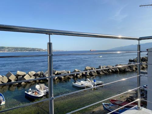 a view of a harbor with boats in the water at Casa Monsù in Torre Faro