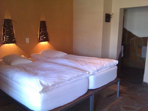 Letto o letti in una camera di Hotel A la Mer