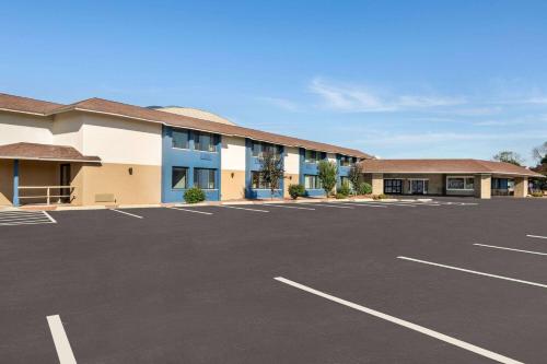 a parking lot in front of a hotel at AmericInn by Wyndham La Crosse Riverfront Conference Center in La Crosse