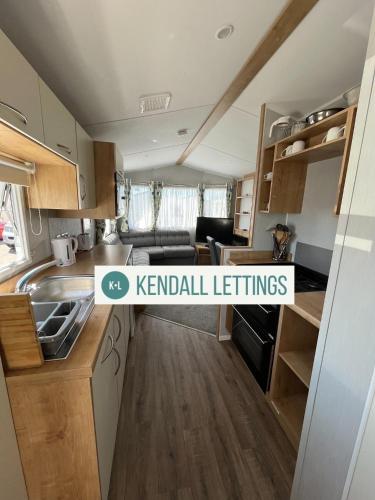 a kitchen with a sign that reads kendall furniture at Willerby (Green Lawns) in Selsey