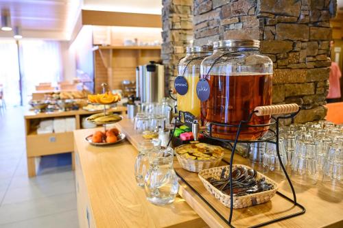 a bar with a drink mixer on a counter at Hotel Jirinka in Dolní Morava