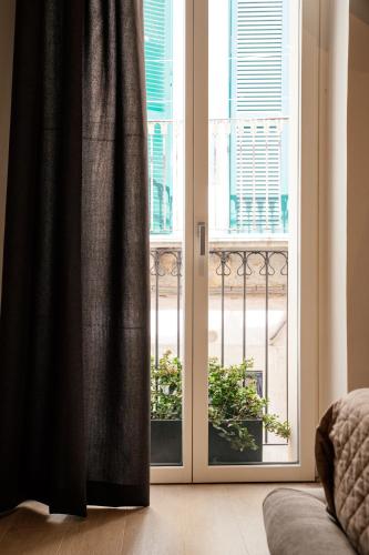 an open door with a view of a balcony at Bed and Breakfast Le Foglie in Altamura