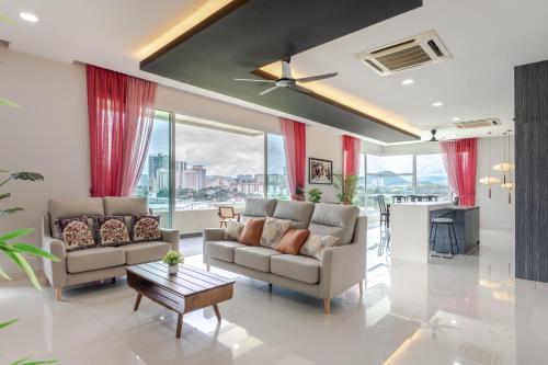 a living room with two couches and a table at New l B5 Near KLCC Peranakan Home 15px in Kuala Lumpur