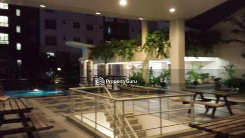 a table and benches on a patio at night at Sky Chalet at Axis Next To LRT Pandan Indah Ampang in Ampang