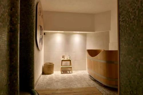 a hallway with a room with a table and a chair at Le Palais Art Hotel Prague in Prague