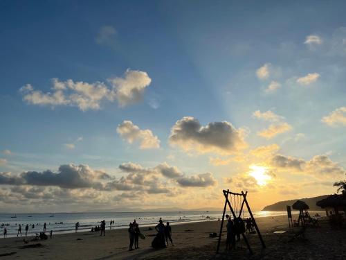 a group of people playing on the beach at Cô Tô Homestay 368 in Chung Cap