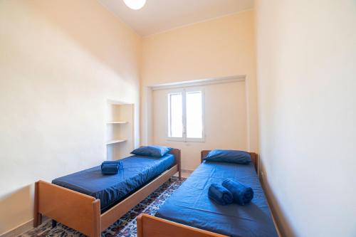 Postel nebo postele na pokoji v ubytování Villa Isidoro