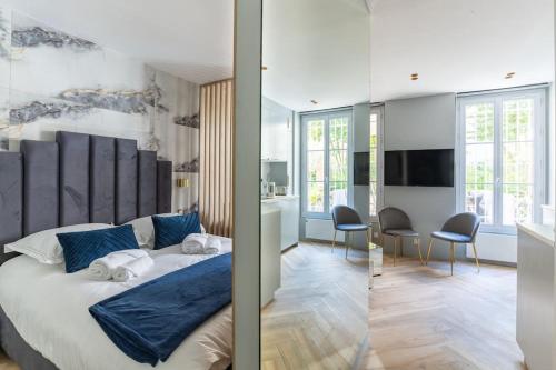 Ένα ή περισσότερα κρεβάτια σε δωμάτιο στο Neuilly/Paris :Magnifique appartement 4P