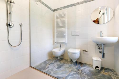 a bathroom with a toilet and a sink and a shower at Pratolina in Savona