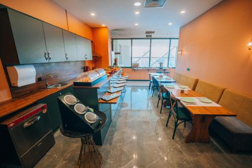 a restaurant with tables and chairs in a room at Roof 264 Hotel & Suites in Sakarya