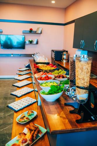 a buffet line with many plates of food on it at Roof 264 Hotel & Suites in Sakarya