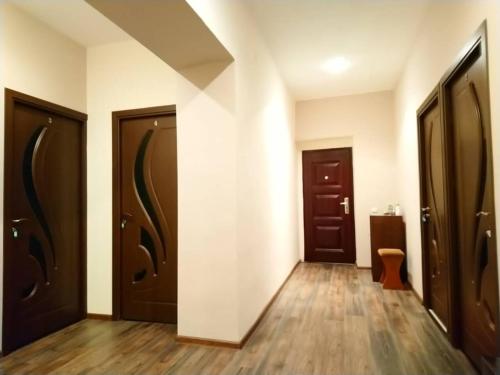 an empty hallway with two doors and a toilet at ApartHotel in Alaverdi in Alaverdi