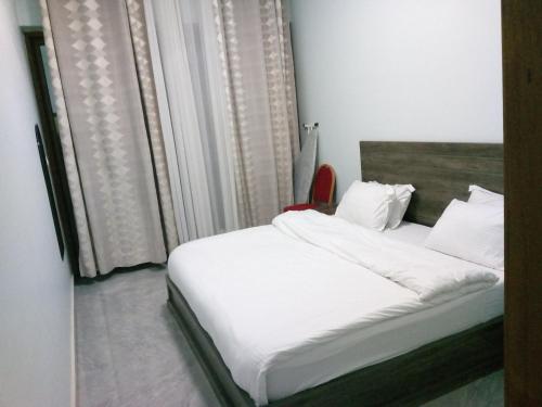 Ένα ή περισσότερα κρεβάτια σε δωμάτιο στο SANTA COLUMBUS APPARTEMENT