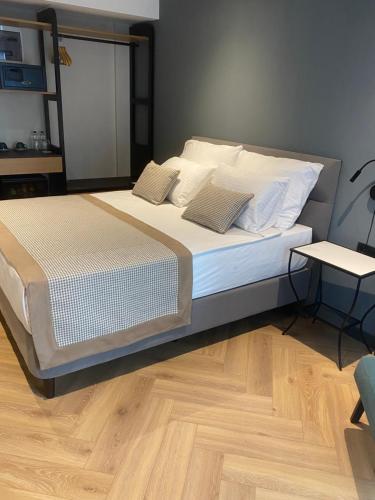 a bed with two pillows on it in a bedroom at İn The Middle Hotel in Antalya