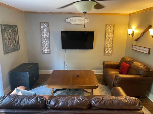 a living room with a couch and a coffee table at Cozy 4br Lake Lanier GA Waterfront- Great Location in Gainesville