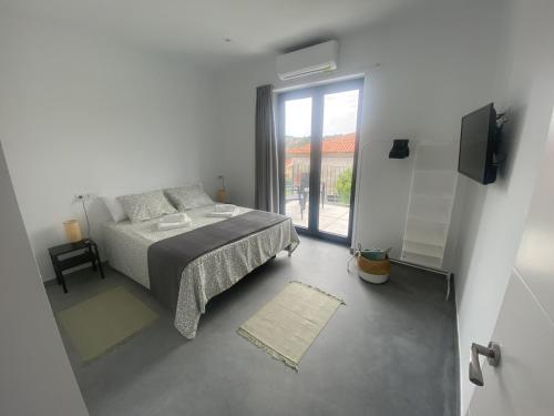 Ένα ή περισσότερα κρεβάτια σε δωμάτιο στο Apartamentos Santamira Street
