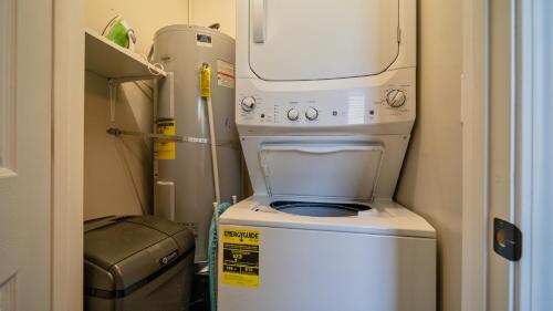 a washer and dryer in a small room at Charming Family Lakeview Cottage 3 min to lake in Dandridge